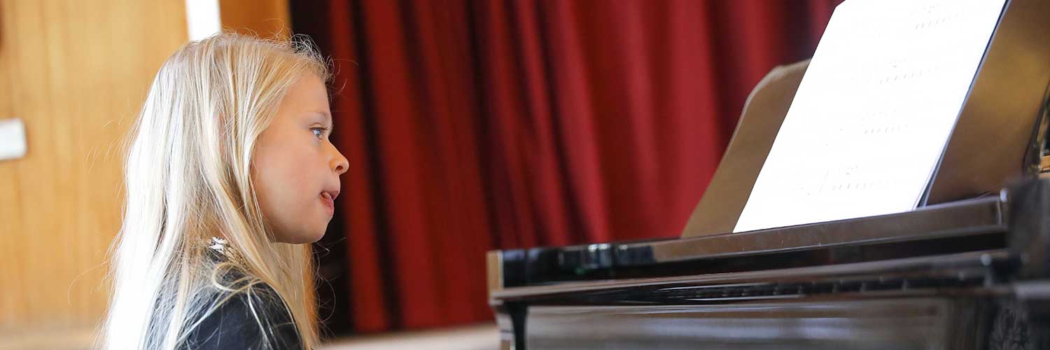 child playing piano